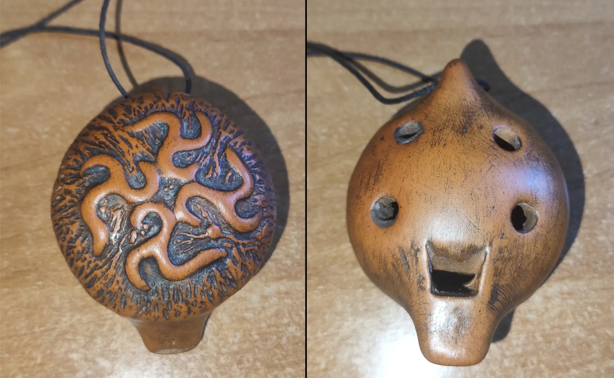 Моя глиняная окарина. Инструментом считаться не может, т.к. не строит вообще. В отверстиях виден пластилин - это попытка привести звуки хоть к какому-то подобию строя.