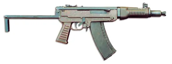 Тут он более заметен, ибо имеет типичный бакелитовый цвет, такой же как у цевья. Также аппер откидной на шарнире, как у ППШ и самых ходовых платформ Armalite (AR-10, AR-15)